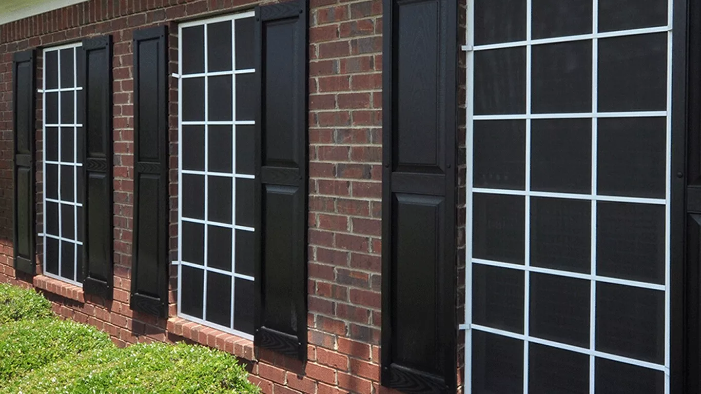 Custom window solar screens installed by CC Shade Solutions on a brick home in Avondale, Arizona, reducing heat, glare, and UV exposure.