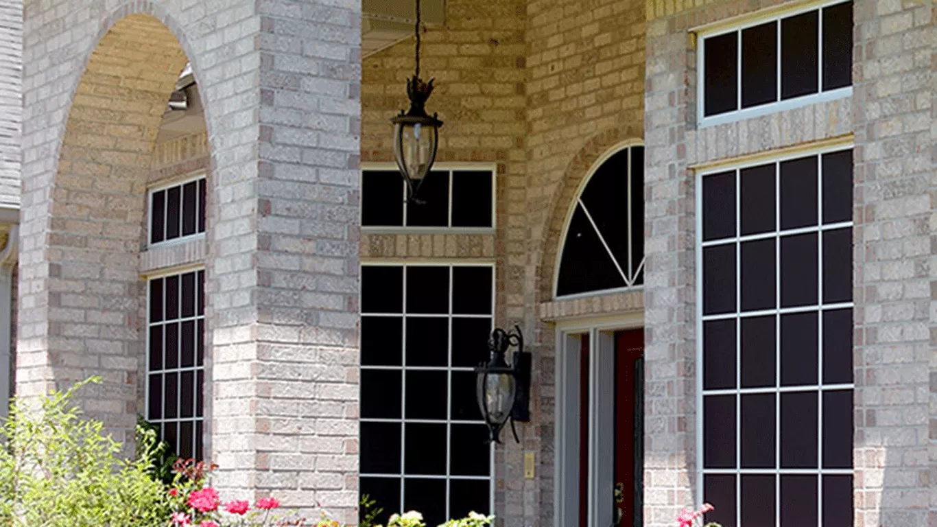 Architectural solar screens installed by CC Shade Solutions on a home in Avondale, Arizona, combining sun protection with modern window design.